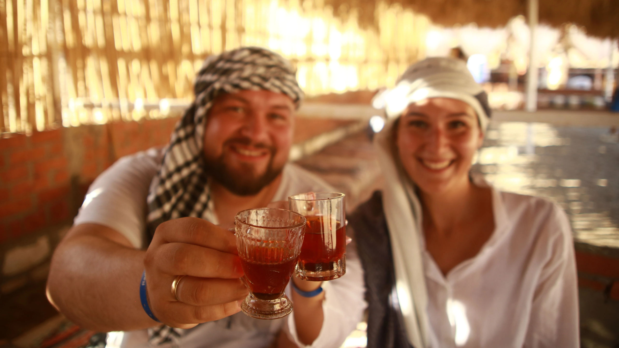 a european couple drinking beduian tea in super safari tour valley by falcon photography.