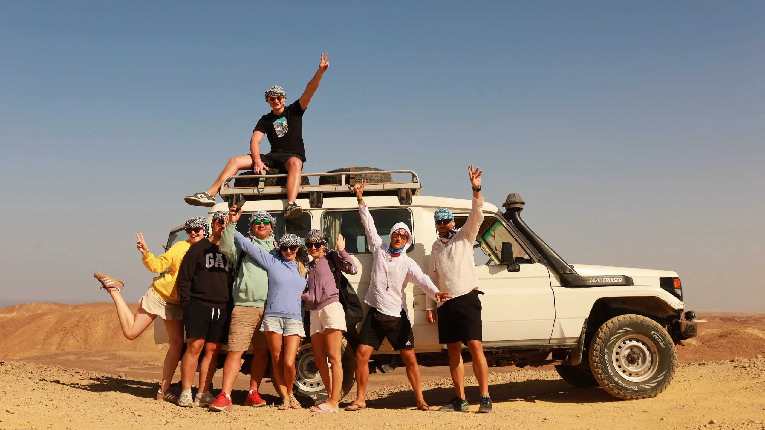 super safari marsa alam jeep journey cuts through the eastern desert, family pausing at a panoramic mountain view